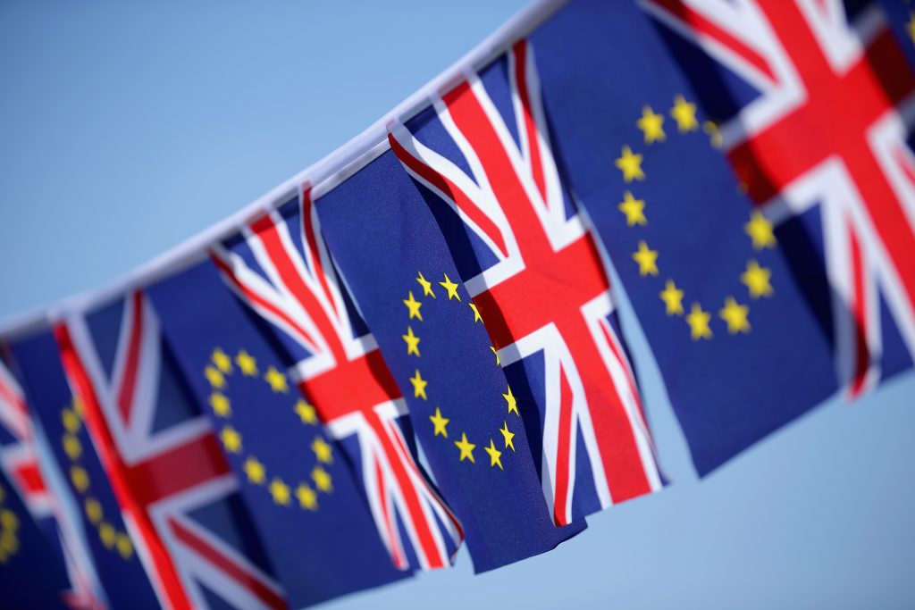 KNUTSFORD, UNITED KINGDOM - MARCH 17: In this photo illustration, the European Union and the Union flag sit together on bunting on March 17, 2016 in Knutsford, United Kingdom. The United Kingdom will hold a referendum on June 23, 2016 to decide whether or not to remain a member of the European Union (EU), an economic and political partnership involving 28 European countries which allows members to trade together in a single market and free movement across its borders for citizens. (Photo by illustration by Christopher Furlong/Getty Images)